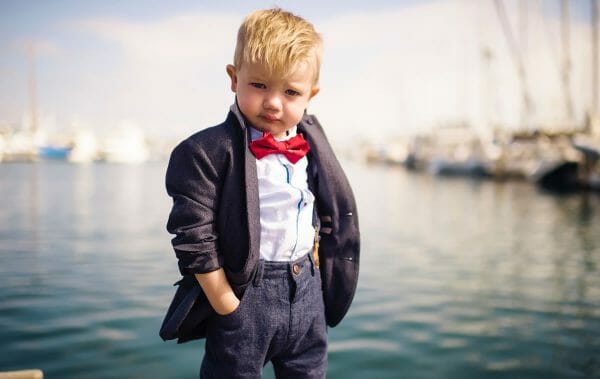 photo of serious young boy dressed for business